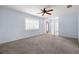 Spacious living room boasts neutral carpet, ceiling fan and plantation shutters at 1813 Lakeview Dr, Brandon, FL 33511