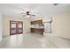 Bright living room features tile floors and patio access near the kitchen at 1813 Lakeview Dr, Brandon, FL 33511