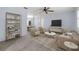 Spacious living room with neutral carpet, ceiling fan, and lots of natural light at 1813 Lakeview Dr, Brandon, FL 33511