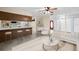 Open concept living and kitchen area with tile flooring and ample seating at 1813 Lakeview Dr, Brandon, FL 33511