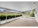 Enclosed sunroom featuring an airy atmosphere and a seamless transition to the outdoor space at 1813 Lakeview Dr, Brandon, FL 33511
