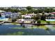 Stunning waterfront homes boast private pools and lush landscaping with ocean views from above at 1967 Brightwaters Ne Blvd, St Petersburg, FL 33704