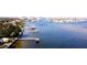 A view of waterfront homes featuring docks and boats on a tranquil, scenic waterway at 1967 Brightwaters Ne Blvd, St Petersburg, FL 33704