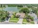 Expansive home with lush landscaping and a tranquil lake view, creating a serene outdoor retreat at 2016 Chelam Way, Brandon, FL 33511