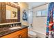 Bathroom featuring a single sink vanity, toilet, and shower-tub combo at 2016 Chelam Way, Brandon, FL 33511
