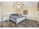 Comfortable bedroom features modern flooring, a ceiling fan, and stylish decor elements at 2016 Chelam Way, Brandon, FL 33511