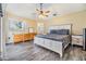 Inviting bedroom featuring wood-look flooring, natural light, and well-coordinated furnishings for a restful retreat at 2016 Chelam Way, Brandon, FL 33511