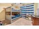 bedroom featuring a bunk bed, blue curtains, and carpeted flooring at 2016 Chelam Way, Brandon, FL 33511