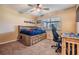 Cozy bedroom featuring a built-in bed frame and a ceiling fan at 2016 Chelam Way, Brandon, FL 33511