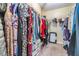 Walk-in closet with metal racking provides ample storage space for clothes, shoes, and accessories at 2016 Chelam Way, Brandon, FL 33511