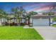 Charming single-story home with well-manicured lawn and colorful landscaping at 2016 Chelam Way, Brandon, FL 33511