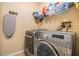 Laundry room featuring a front load washer and dryer with wire rack shelving at 2016 Chelam Way, Brandon, FL 33511