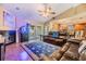 This living room showcases a cozy layout with a fireplace, glass doors, and comfortable seating options at 2016 Chelam Way, Brandon, FL 33511