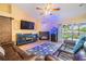 Bright living room featuring a sliding glass door, fireplace, and stylish decor that creates a welcoming atmosphere at 2016 Chelam Way, Brandon, FL 33511