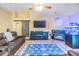 Spacious living room with a sliding barn door, sleek fireplace, and comfortable leather seating arrangement at 2016 Chelam Way, Brandon, FL 33511