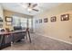 Functional home office with soft carpet, plenty of workspace, and natural light, perfect for productivity at 2016 Chelam Way, Brandon, FL 33511