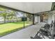 Screened-in patio featuring waterfront views and outdoor seating, ideal for relaxation at 2016 Chelam Way, Brandon, FL 33511