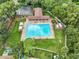 Aerial view of community pool with ample seating, cabanas, and playground at 2016 Chelam Way, Brandon, FL 33511