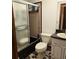 Bathroom features a shower with sliding door, and a white sink at 2226 Giralda Ave, Spring Hill, FL 34606