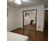 This bedroom features wood floors and closet with sliding mirror doors at 2226 Giralda Ave, Spring Hill, FL 34606