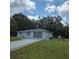Single story home featuring a well kept lawn and privacy fencing on a partly cloudy day at 2226 Giralda Ave, Spring Hill, FL 34606