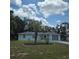 Single-story home with a healthy lawn, tasteful landscaping, and inviting curb appeal at 2226 Giralda Ave, Spring Hill, FL 34606
