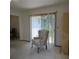 Living room with neutral carpet, view to the outside, and chair at 2226 Giralda Ave, Spring Hill, FL 34606