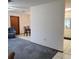 Open-concept living room offering a view of the dining room and partially obscured kitchen at 2226 Giralda Ave, Spring Hill, FL 34606