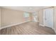 Inviting bedroom with neutral walls, white trim, hardwood floors, and two windows providing ample natural light at 239 Freeport Ne Ave, St Petersburg, FL 33702