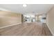 Bright open-concept living area with sleek floors, leading to a modern kitchen and dining area at 239 Freeport Ne Ave, St Petersburg, FL 33702