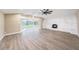 Bright living room featuring vaulted ceilings, a brick fireplace, and large picture windows at 239 Freeport Ne Ave, St Petersburg, FL 33702