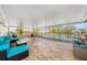 Enclosed pool area with neutral tile, comfortable seating, and clear views of the backyard and pool at 239 Freeport Ne Ave, St Petersburg, FL 33702