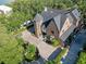 Aerial view of a stunning home featuring a beautifully landscaped yard and elegant architecture at 2902 W Fair Oaks Ave, Tampa, FL 33611