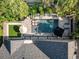 An aerial view highlighting the private backyard pool, lush landscaping and modern design of the property at 2902 W Fair Oaks Ave, Tampa, FL 33611