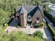 A bird's eye view showcasing a luxurious residence with manicured grounds and a circular driveway at 2902 W Fair Oaks Ave, Tampa, FL 33611