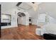 Expansive bedroom with hardwood floors, chandelier, and access to an ensuite bathroom at 2902 W Fair Oaks Ave, Tampa, FL 33611