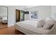 Bright bedroom with a mirrored closet, en-suite bathroom, and a large window, perfect for a serene retreat at 2902 W Fair Oaks Ave, Tampa, FL 33611