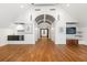 Grand bedroom with hardwood floors, an arched ceiling, recessed lighting, and white accents at 2902 W Fair Oaks Ave, Tampa, FL 33611