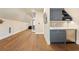 Bonus room offering a wet bar with grey cabinets, marble countertops, hardwood floors, and recessed lighting at 2902 W Fair Oaks Ave, Tampa, FL 33611