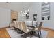 Formal dining room with stone fireplace, modern chandelier, large table with seating for ten, and stylish decor at 2902 W Fair Oaks Ave, Tampa, FL 33611
