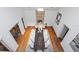 Expansive dining room featuring a long table, modern chandelier, fireplace and hardwood floors for elegant entertaining at 2902 W Fair Oaks Ave, Tampa, FL 33611