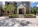 Charming stone and brick home showcases a welcoming entrance with well-kept landscaping at 2902 W Fair Oaks Ave, Tampa, FL 33611