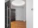Elegant foyer with dark wood door, hardwood floors, recessed lighting, and a thermostat at 2902 W Fair Oaks Ave, Tampa, FL 33611