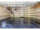 Organized garage with epoxy flooring and ample shelving for storage, providing a clean and functional space at 2902 W Fair Oaks Ave, Tampa, FL 33611