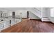Upstairs hallway featuring hardwood floors, modern railings, and ample natural light at 2902 W Fair Oaks Ave, Tampa, FL 33611
