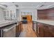 Gourmet kitchen with double sinks, stainless steel appliances, custom cabinets, and views to the living room at 2902 W Fair Oaks Ave, Tampa, FL 33611