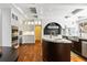 Spacious kitchen with stainless steel appliances, marble countertops, custom cabinets, and a unique range hood at 2902 W Fair Oaks Ave, Tampa, FL 33611