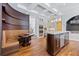 Gourmet kitchen with breakfast nook, marble countertops, stainless steel appliances, and custom cabinetry at 2902 W Fair Oaks Ave, Tampa, FL 33611
