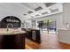 Elegant kitchen featuring marble countertops, stainless steel appliances, and scenic views of the pool and backyard at 2902 W Fair Oaks Ave, Tampa, FL 33611