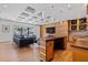Contemporary living room with modern decor, wood paneling, custom ceiling, and seamless access to outdoor living area at 2902 W Fair Oaks Ave, Tampa, FL 33611